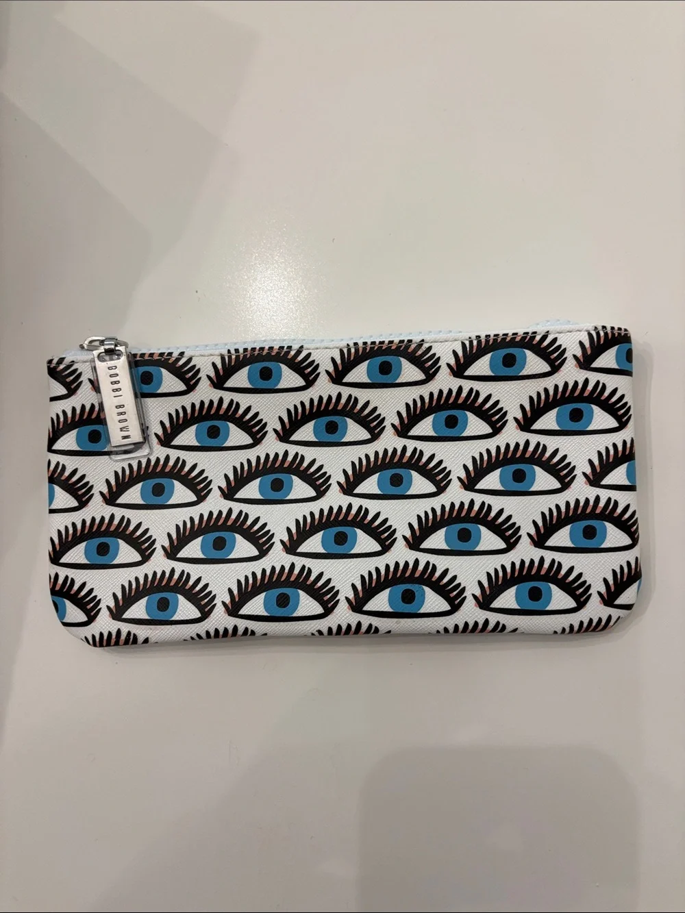 Bobbi Brown Blue Eye Print Zip Pouch in White, Black and Blue